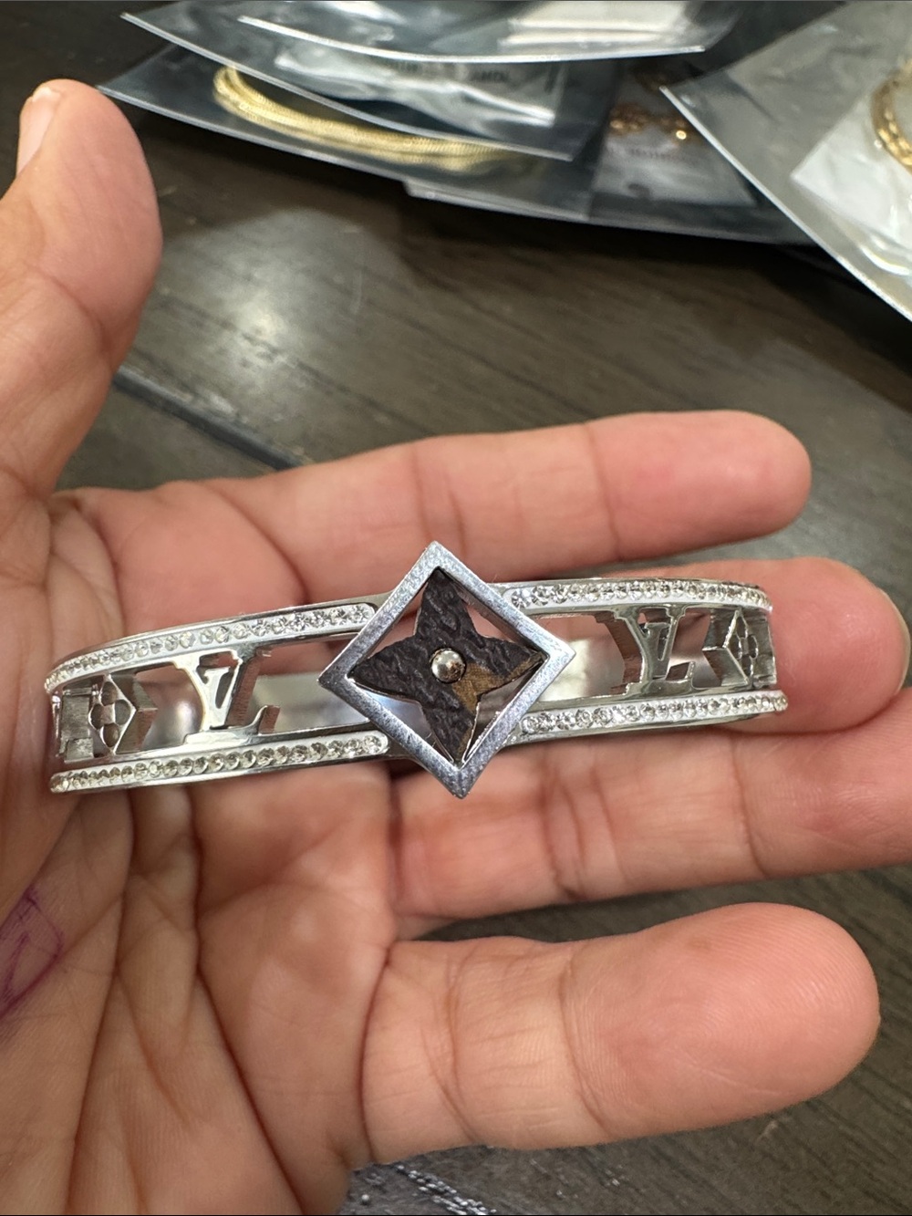 Silver-Tone Logo Cuff with Brown Diamond Accent
